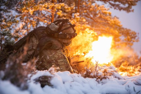 A Soldier fires blank rounds through an M240 machine gun during Hammer 22, an annual combined forces exercise conducted by and alongside the Finnish army in Niinisalo, Finland, Nov. 9, 2022.