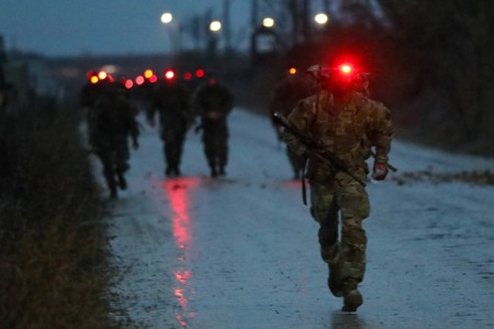 Soldiers from the 101st Airborne Division participate in a six-mile foot march at Mihail Kogalniceanu Airbase, Romania, Nov. 23, 2022. The march is the beginning of the second phase of Air Assault School with Soldiers having to travel six miles in under 90 minutes.
