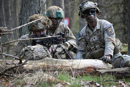 U.S. Army paratroopers assigned to Anvil Troop, 1st Squadron, 91st Cavalry Regiment, 173rd Airborne Brigade emplace an M240 machine gun while conducting a platoon attack exercise near Camp Beverlo, Belgium on April 13, 2023.
