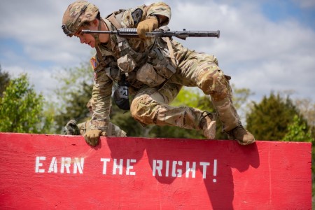 A competitor vaults over an obstacle in the 2023 U.S. Army Best Sapper Competition, held at Fort Leonard Wood, Mo.